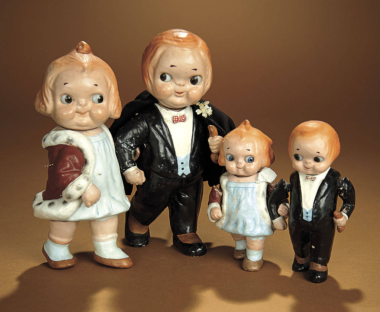 If these dolls look familiar, it’s because they were designed by the artist who made similar children for Campbell Soup ads. The set sold for $6,880. (Cowles Syndicate Inc.)