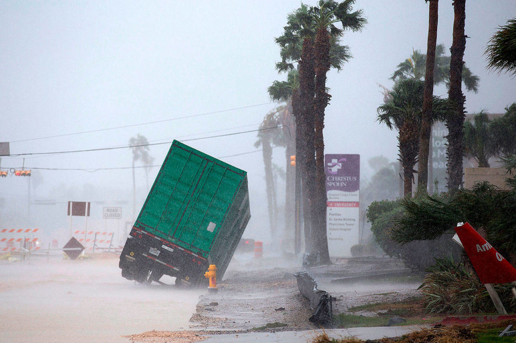 A power generator tips in front of Texas’ CHRISTUS Spohn Hospital in Corpus Christi, Texas, as Hurricane Harvey hits Friday. (Courtney Sacco /Corpus Christi Caller-Times via AP)
