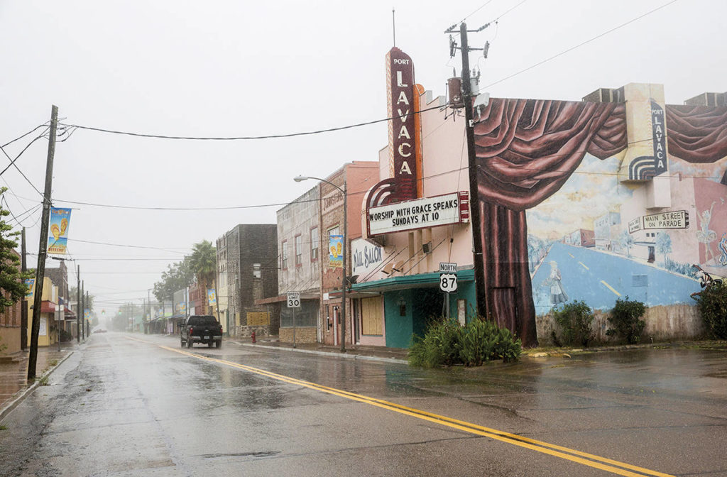 A single truck drives down a street as Hurricane Harvey makes landfall in downtown Port Lavaca, Texas on Friday. (Ana Ramirez/The Victoria Advocate via AP)
