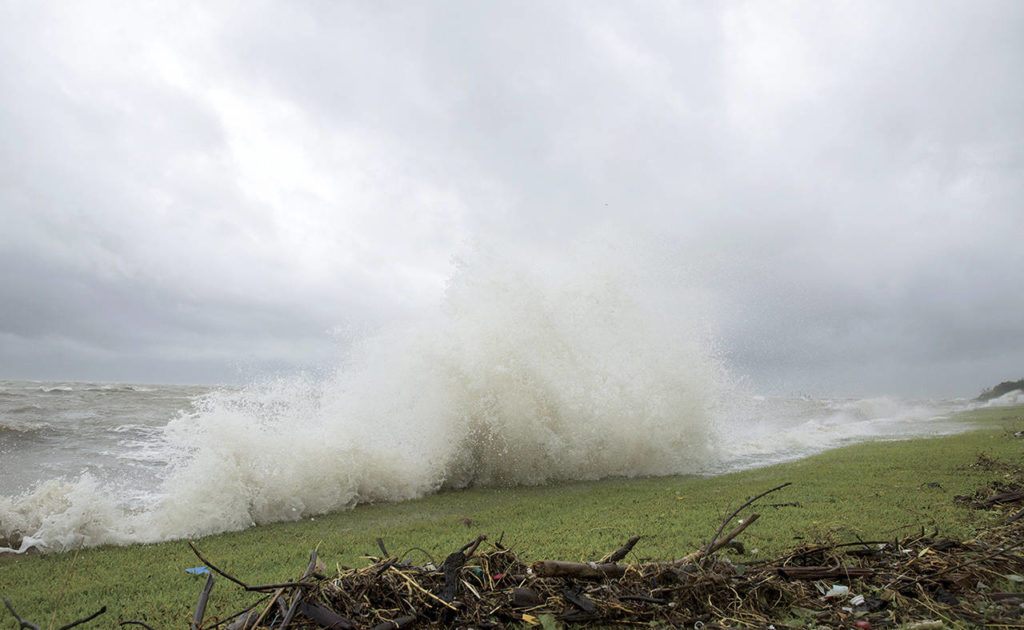 Water crashes along the bay front in Port Lavaca, Texas, on Friday. (Ana Ramirez/The Victoria Advocate via AP)
