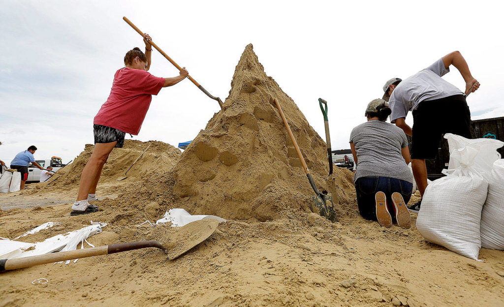 Residents fill sand bags as they prepare for Hurricane Harvey on Thursday in Corpus Christi, Texas. (AP Photo/Eric Gay)
