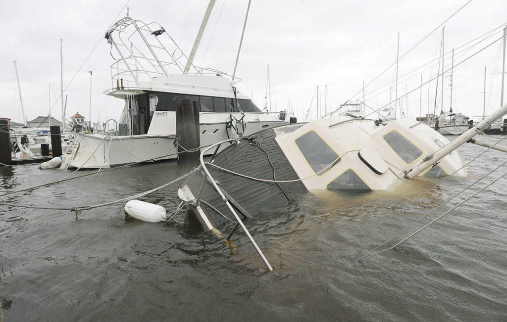 A boat is partially submerged in the wake of Hurricane Harvey on Saturday in Rockport, Texas. (AP Photo/Eric Gay)
