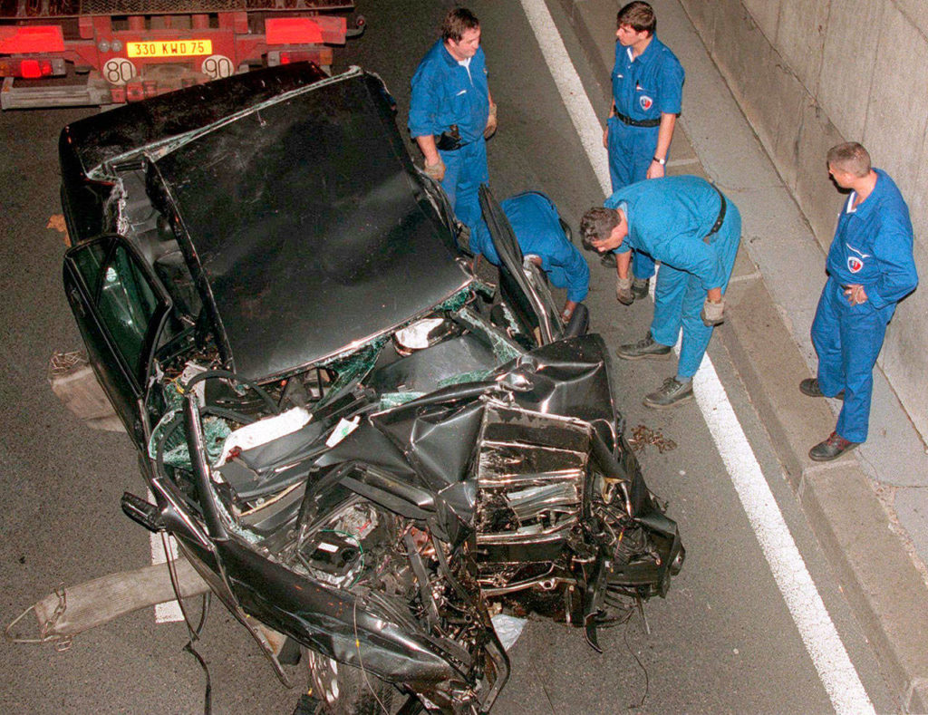 On Aug. 31, 1997, police workers prepare to take away the car in which Britain’s Diana, Princess of Wales, died in Paris. (AP Photo/Jerome Delay)
