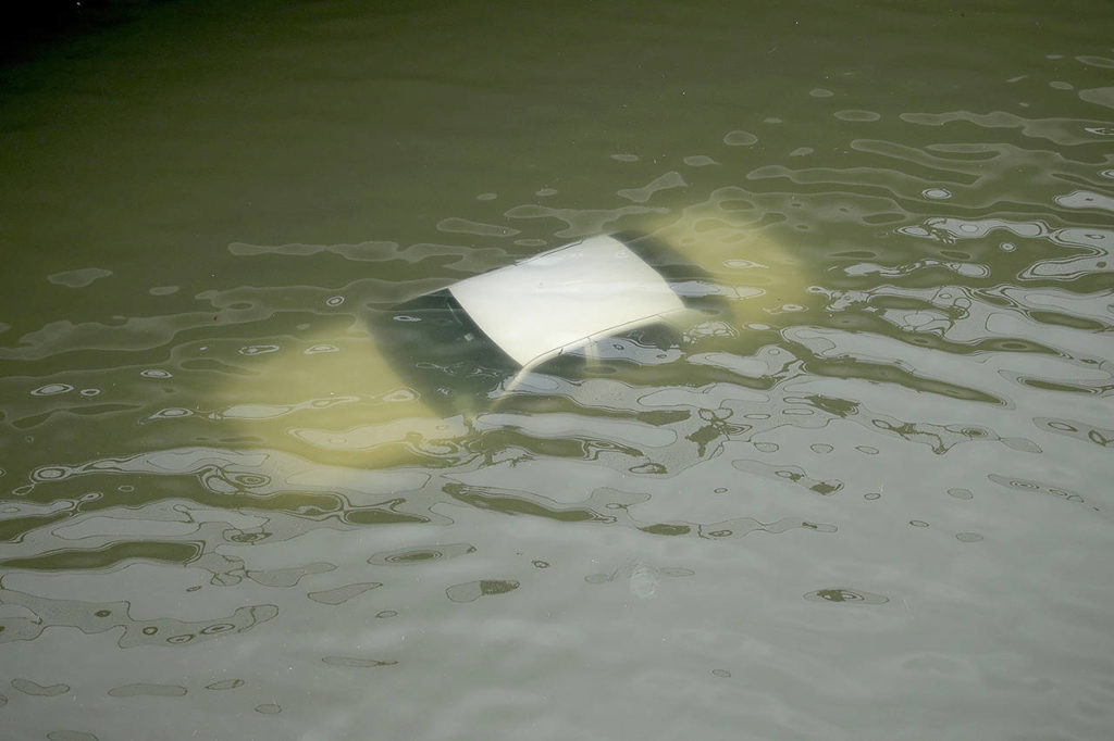 A car is submerged on a freeway flooded by Tropical Storm Harvey on Sunday near downtown Houston, Texas. (AP Photo/Charlie Riedel)
