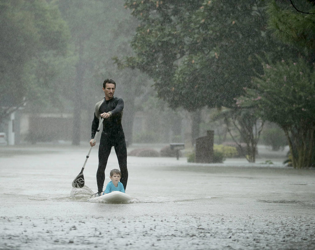 Alexendre Jorge evacuates Ethan Colman, 4, from a neighborhood inundated by floodwaters from Tropical Storm Harvey on Monday in Houston, Texas. (AP Photo/Charlie Riedel)
