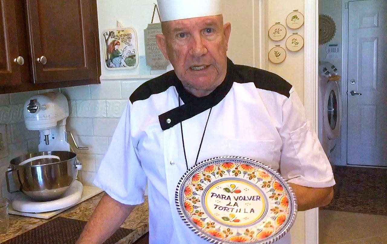 Armando Perez explains the special “para volver la tortilla” plate he uses to make Cuban breakfast tortillas: “That means ‘to turn the tortilla over.’” (Suzanne Perez Tobias / Wichita Eagle)