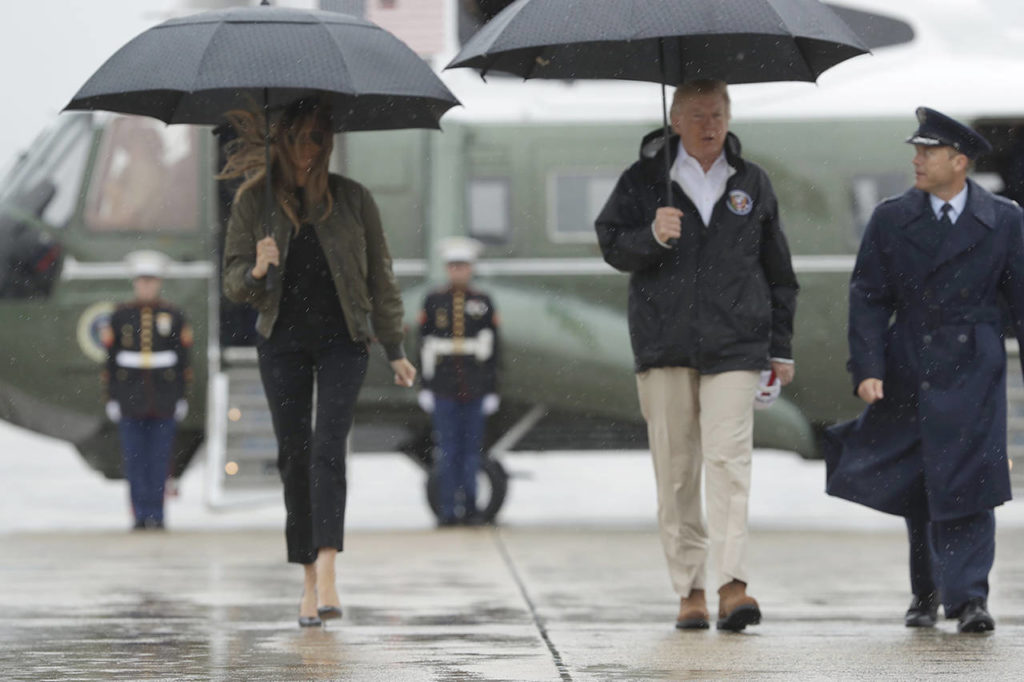 President Donald Trump and first lady Melania Trump walk from Marine One to board Air Force One at Andrews Air Force Base, Maryland on Tuesday for a trip to Texas to get an update on Hurricane Harvey relief efforts. (AP Photo/Evan Vucci)
