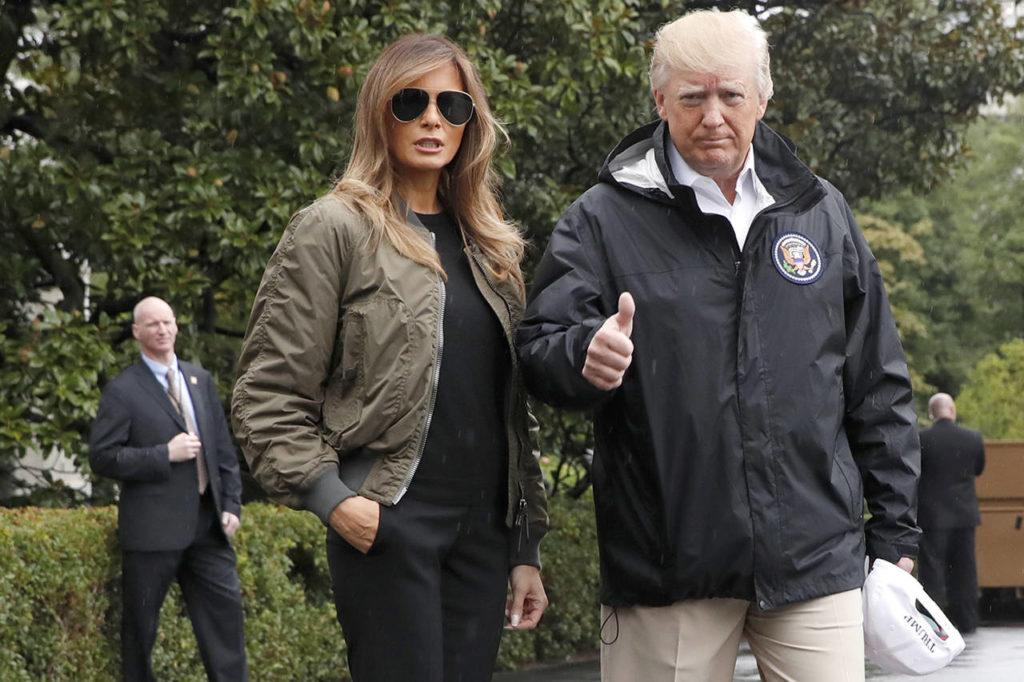 President Donald Trump, accompanied by first lady Melania Trump, gives a thumbs-up as they walk to Marine One on the South Lawn of the White House in Washington on Tuesday. (AP Photo/Jacquelyn Martin)
