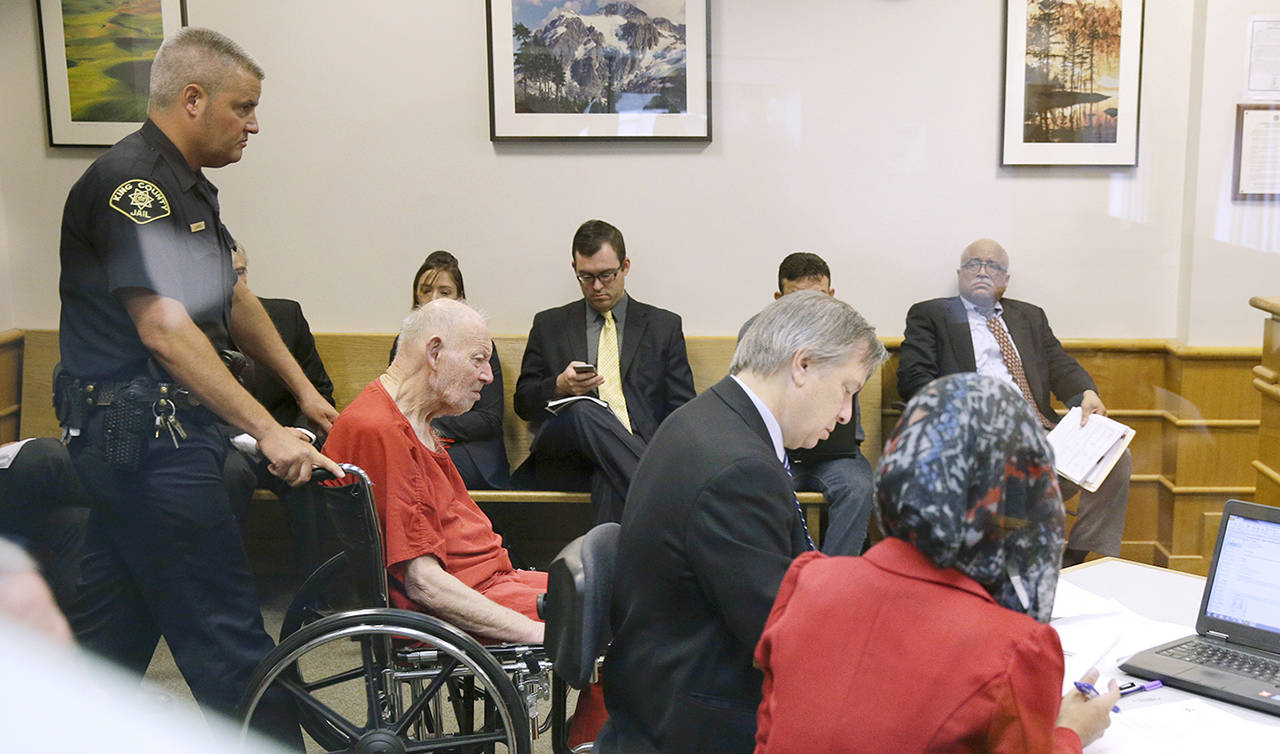 Charles Emery is brought into court in a wheelchair as he appears for an arraignment hearing Thursday in Seattle. Emery is one of three elderly brothers facing child pornography charges after their arrest earlier in the month. (AP Photo/Ted S. Warren)