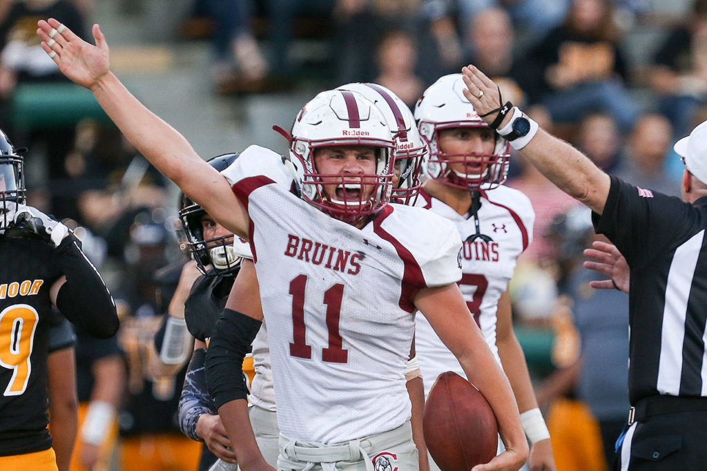 Cascade’s Max Nelson signals a turnover during a game against Inglemoor on Aug. 31, 2017, at Pop Keeney Stadium in Bothell. (Kevin Clark / The Herald)
