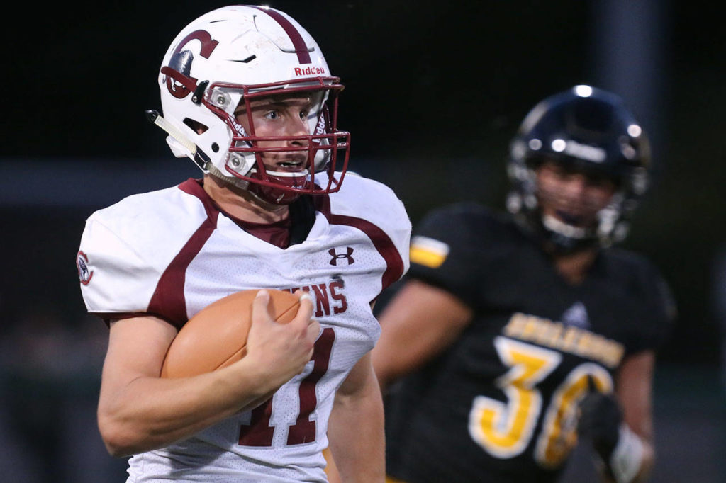 Cascade’s Max Nelson carries the ball during a game against Inglemoor on Aug. 31, 2017, at Pop Keeney Stadium in Bothell. (Kevin Clark / The Herald)
