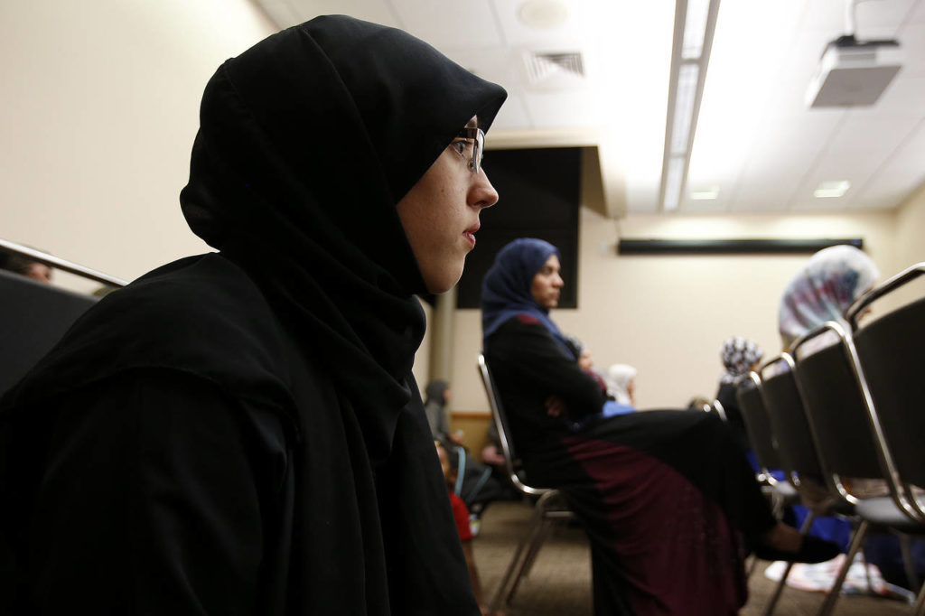 Amanda Smith listens to an evening service for the Zainab Center at the Lynnwood Convention Center on Thursday, Aug. 31. (Ian Terry / The Herald)
