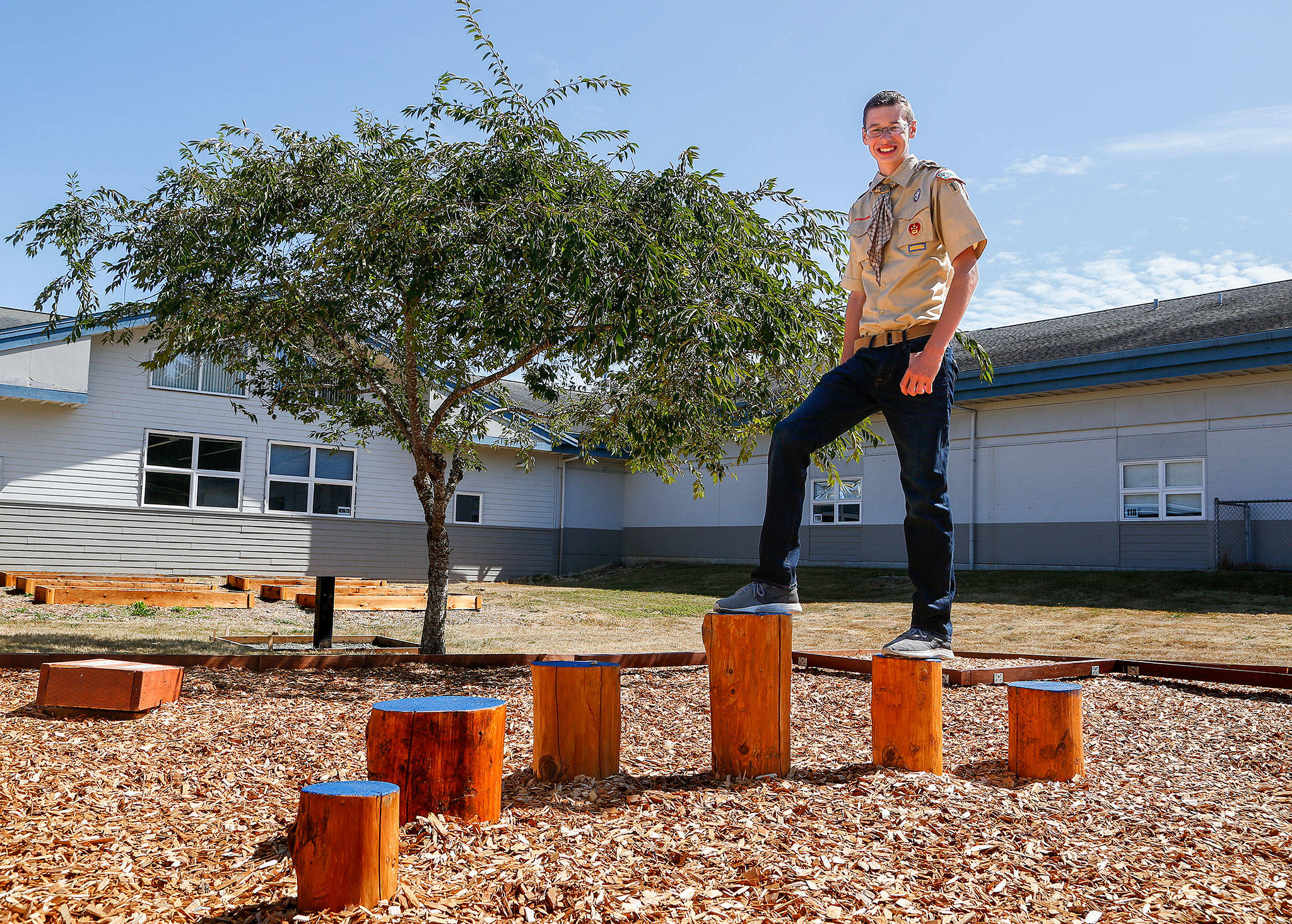 As his Eagle Scout project, Wesley Lawson, 15, is building this “life skills playground” at Lake Stevens Middle School for children with special needs. (Dan Bates / The Herald)