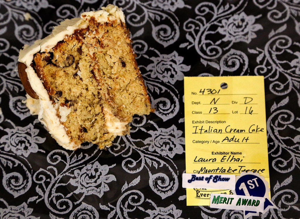 Laura Elhai’s Italian Cream Cake was obviously a favorite of the judges, who kept adding new stickers to her blue ribbon. Any excuse for another bite! (Dan Bates / The Herald)
