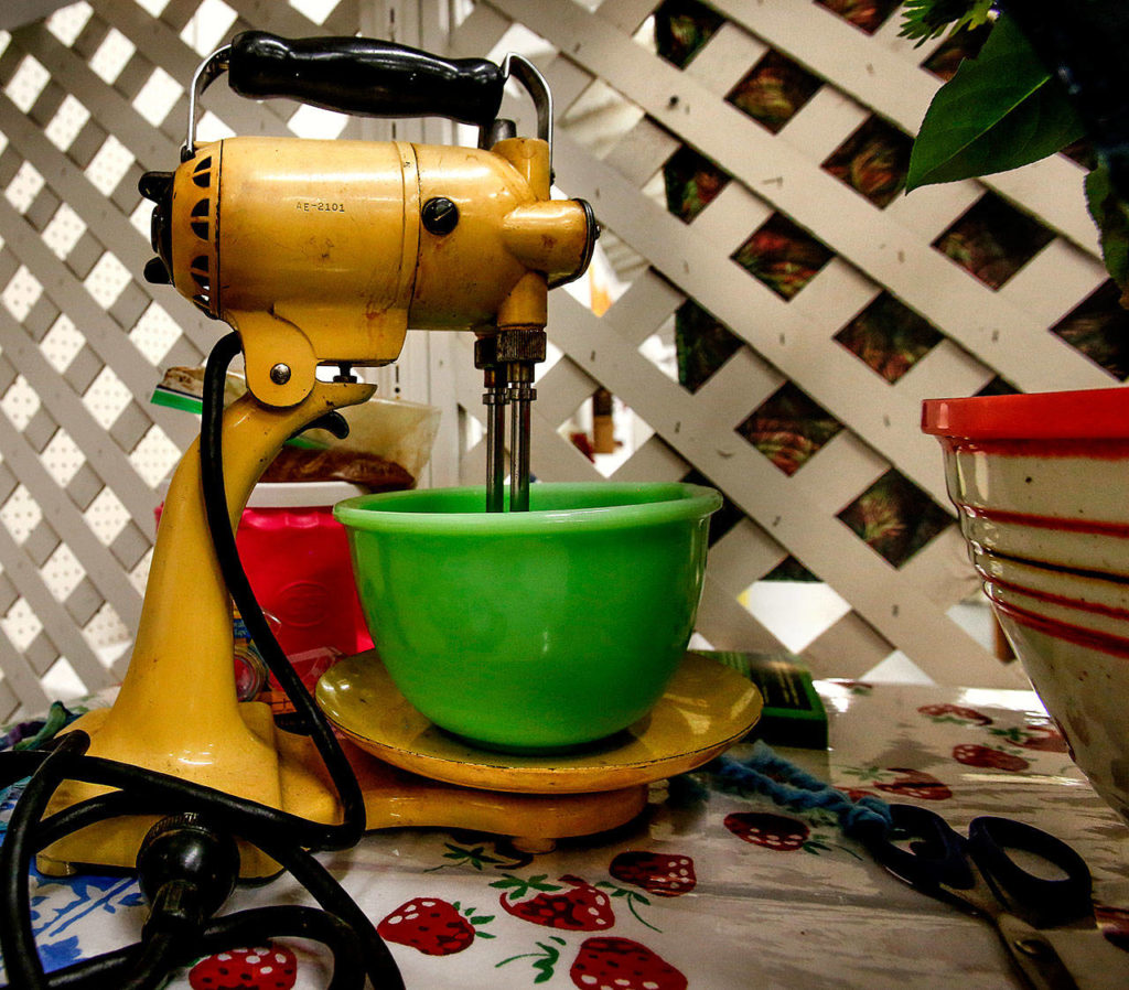 This year, Laura Elhai heads the American Heritage exhibit on the 1950s. The well-used Sunbeam mixer in that vintage display actually works, Elhai says. (Dan Bates / The Herald)
