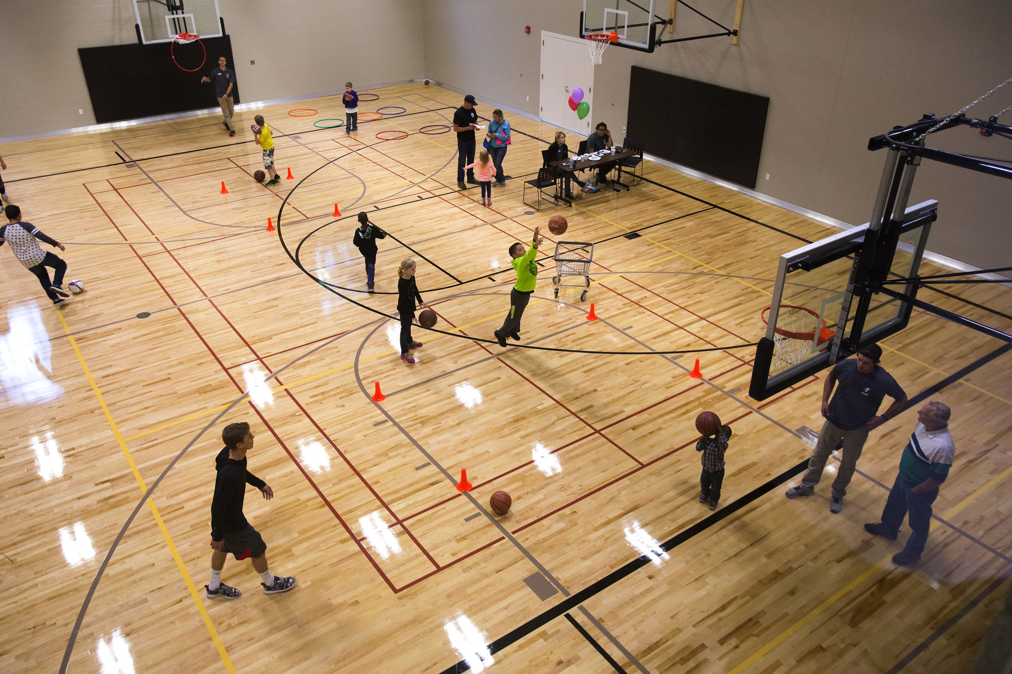 Visitors and members play in the gym during the September 2016 grand opening of the Stanwood-Camano YMCA in Stanwood. The facility is now 1 year old. (Andy Bronson / Herald file)