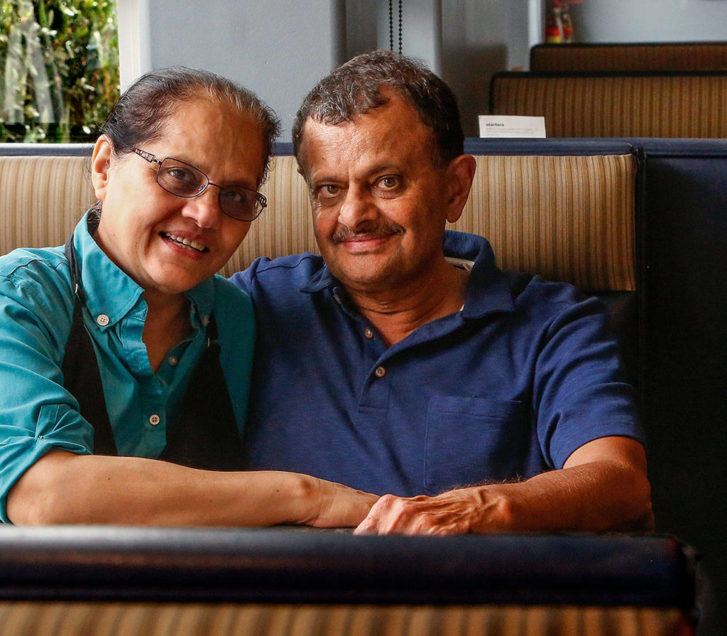 Shabbir Bala (right) had a heart transplant in 2016 and has been on 37 hikes since the operation. Now that he and his wife Ruqayya (left) have closed their restaurant, Boondockers, they’re looking forward to traveling. (Dan Bates / The Herald)
