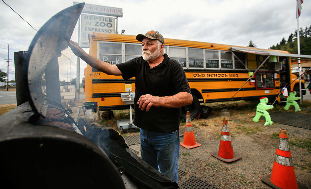 Henry Smiciklas cooks his meat fresh every day at his and wife Leanne’s Old School BBQ east of Monroe. (Dan Bates / The Herald)
