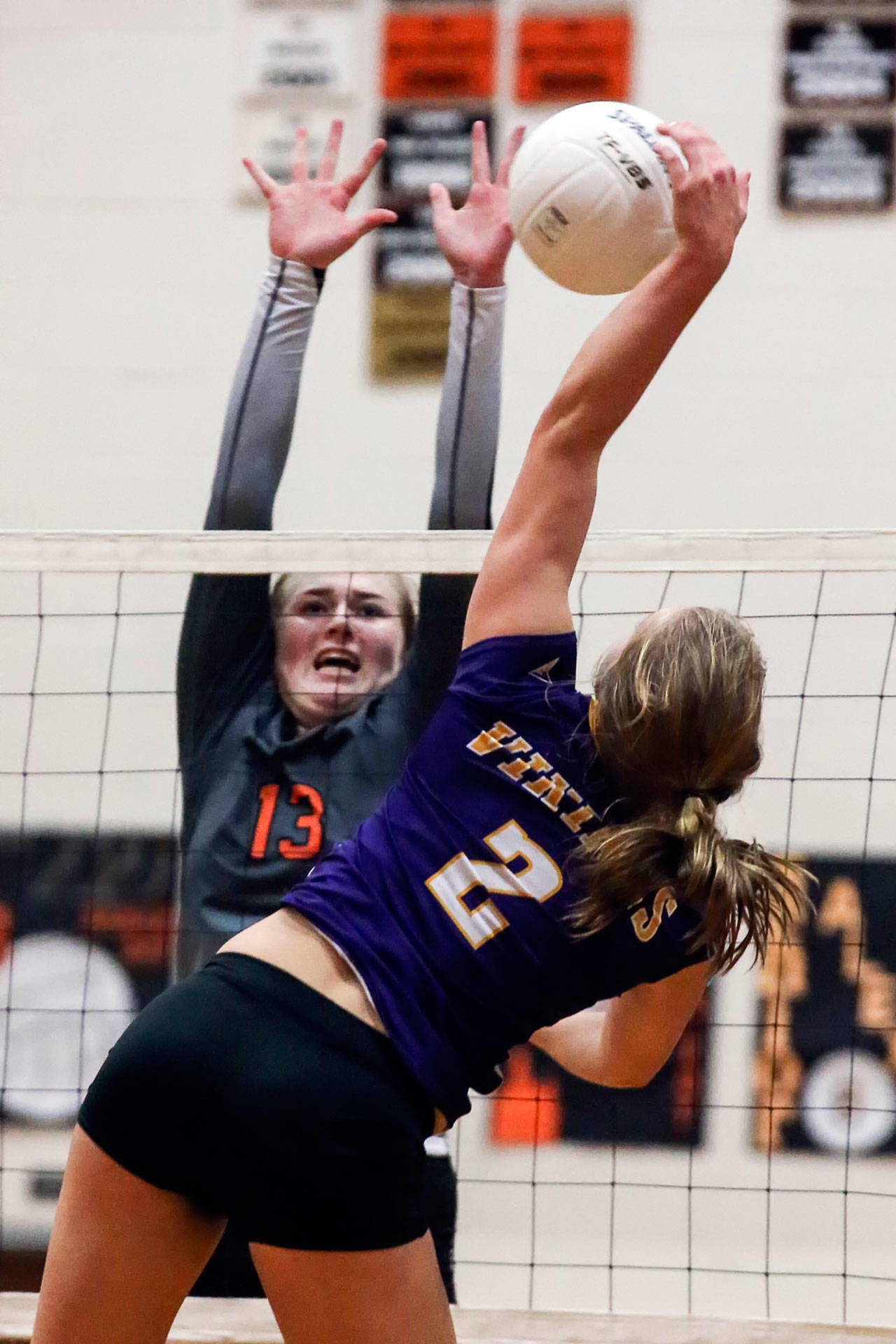 Lake Stevens’ Lilly Eason attempts to spike a ball with Monroe’s Samantha Zimmerman defending during the Vikings’ five-set victory over the Bearcats on Oct. 20, 2016 in Monroe. Eason and Zimmerman should have their respective teams near the top of the Wesco 4A standings in 2017. (Kevin Clark / The Herald)