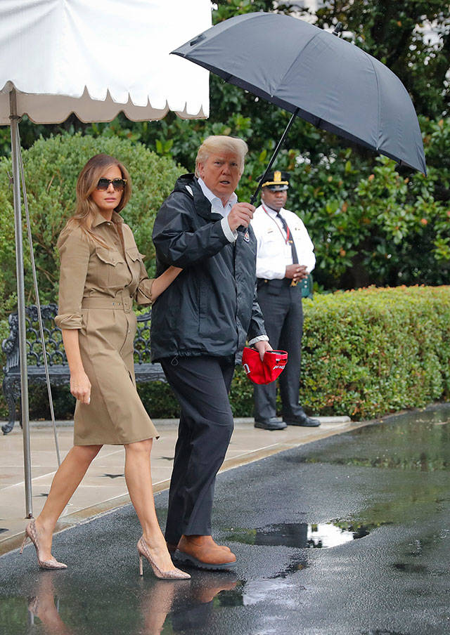 President Donald Trump and first lady Melania Trump walk out to the South Lawn of the White House in Washington to board Marine One helicopter for the short flight to nearby Andrews Air Force Base, Md., Saturday, Sept. 2, 2017. Trump is traveling to Houston and Lake Charles , Louisiana, to survey the damage wrought by Hurricane Harvey. (AP Photo/Pablo Martinez Monsivais)