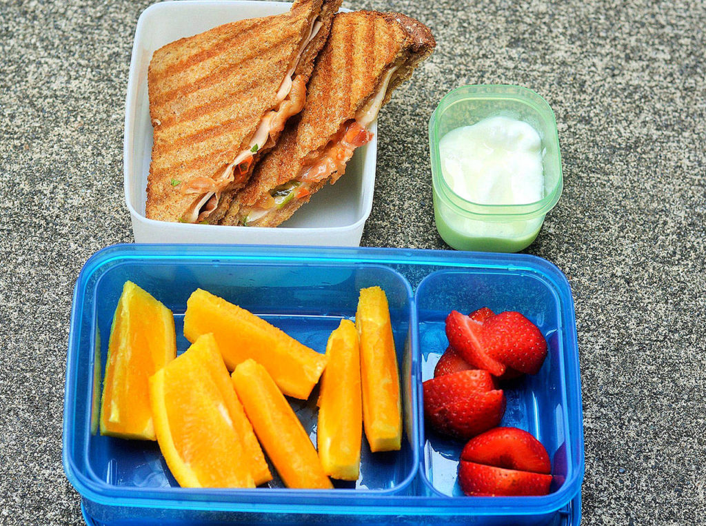 Ham and cheese panini sandwiches are good served hot off the grill or cold in a lunchbox. (Reshma Seetharam)
