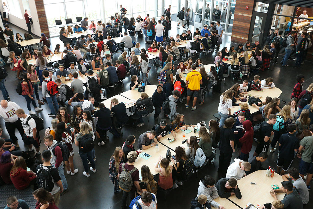 Students gather in the common area at the new Lakewood High School building before orientation and tours Wednesday. (Andy Bronson / The Herald)