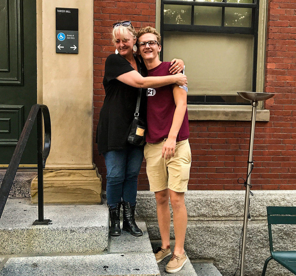 Rochelle Clinton, of Monroe, gives her son, Ethan Medlin, a goodbye hug during move-in days at Harvard University. Medlin has a full-ride scholarship at Harvard. During his sophomore year at Monroe High School, the family was homeless for a time. (Courtesy of Ethan Medlin)
