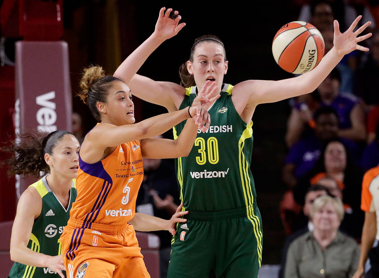 Mercury guard Leilani Mitchell (5) passes the ball as Storm forward Breanna Stewart (30) defends during the first half of a first-round playoff game Sept. 6, 2017, in Tempe, Ariz. (AP Photo/Matt York)