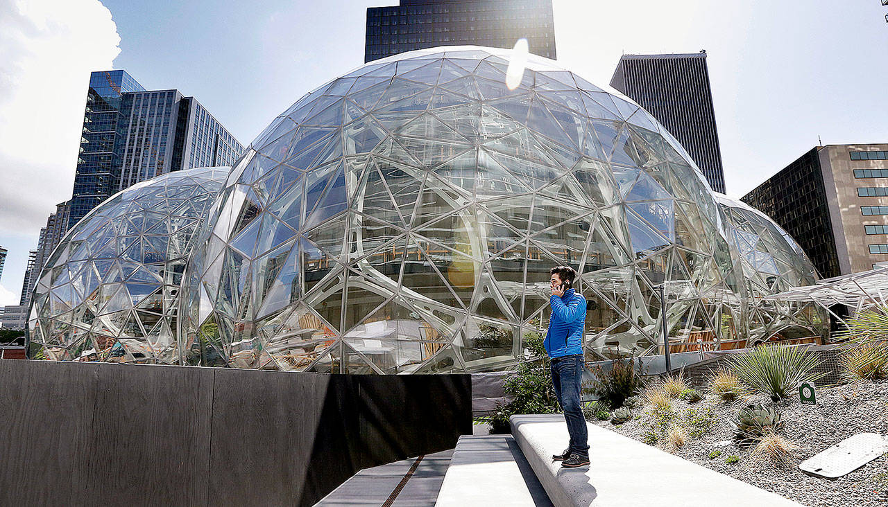The Amazon campus in downtown Seattle. The tallest of the three interconnected spheres, called Amazon Spheres by the company, is 90 feet high and 130 feet in diameter. The structures are to open to employees in early 2018. (AP Photo/Elaine Thompson)