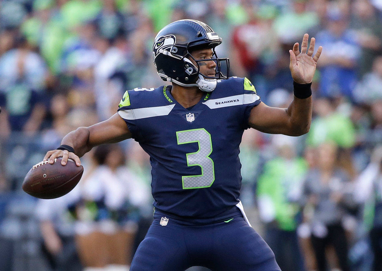 Seahawks quarterback Russell Wilson passes against the Chiefs during the first half of a preseason game Aug. 25, 2017, in Seattle. (AP Photo/Elaine Thompson)