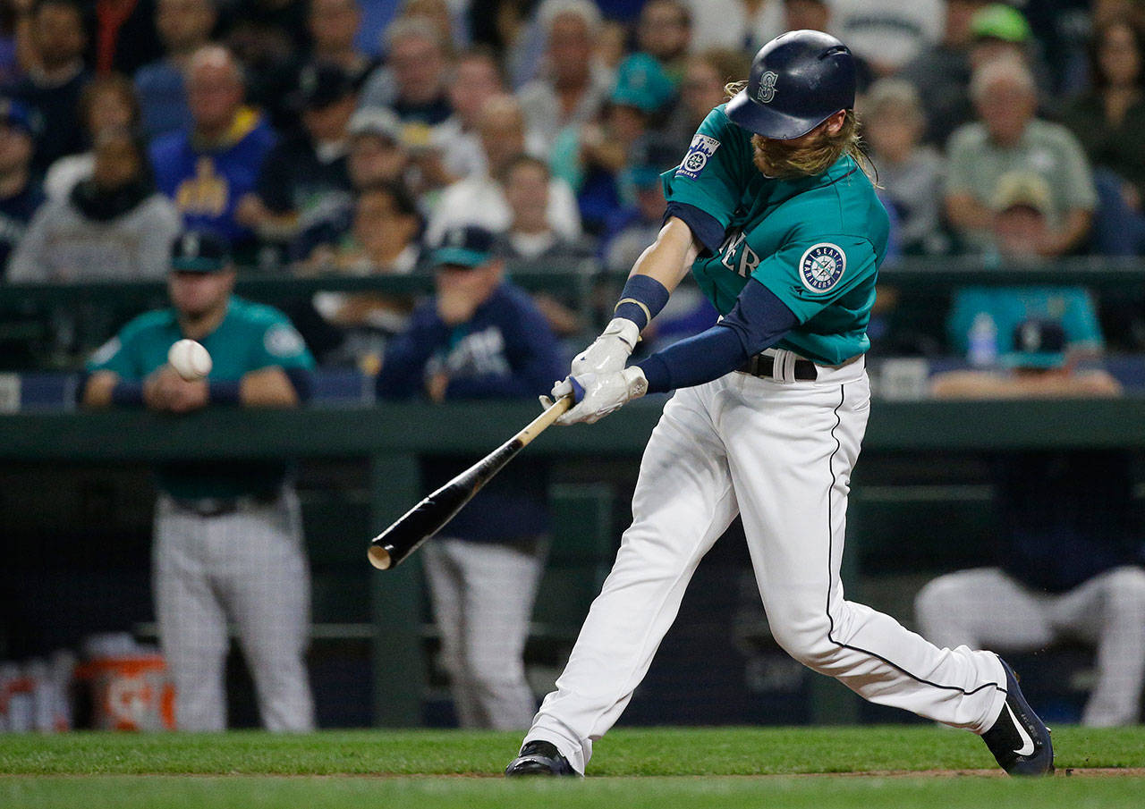 The Mariners’ Ben Gamel hits a three-run home run against the Angels during the second inning of a game Sept. 8, 2017, in Seattle. (AP Photo/Ted S. Warren)