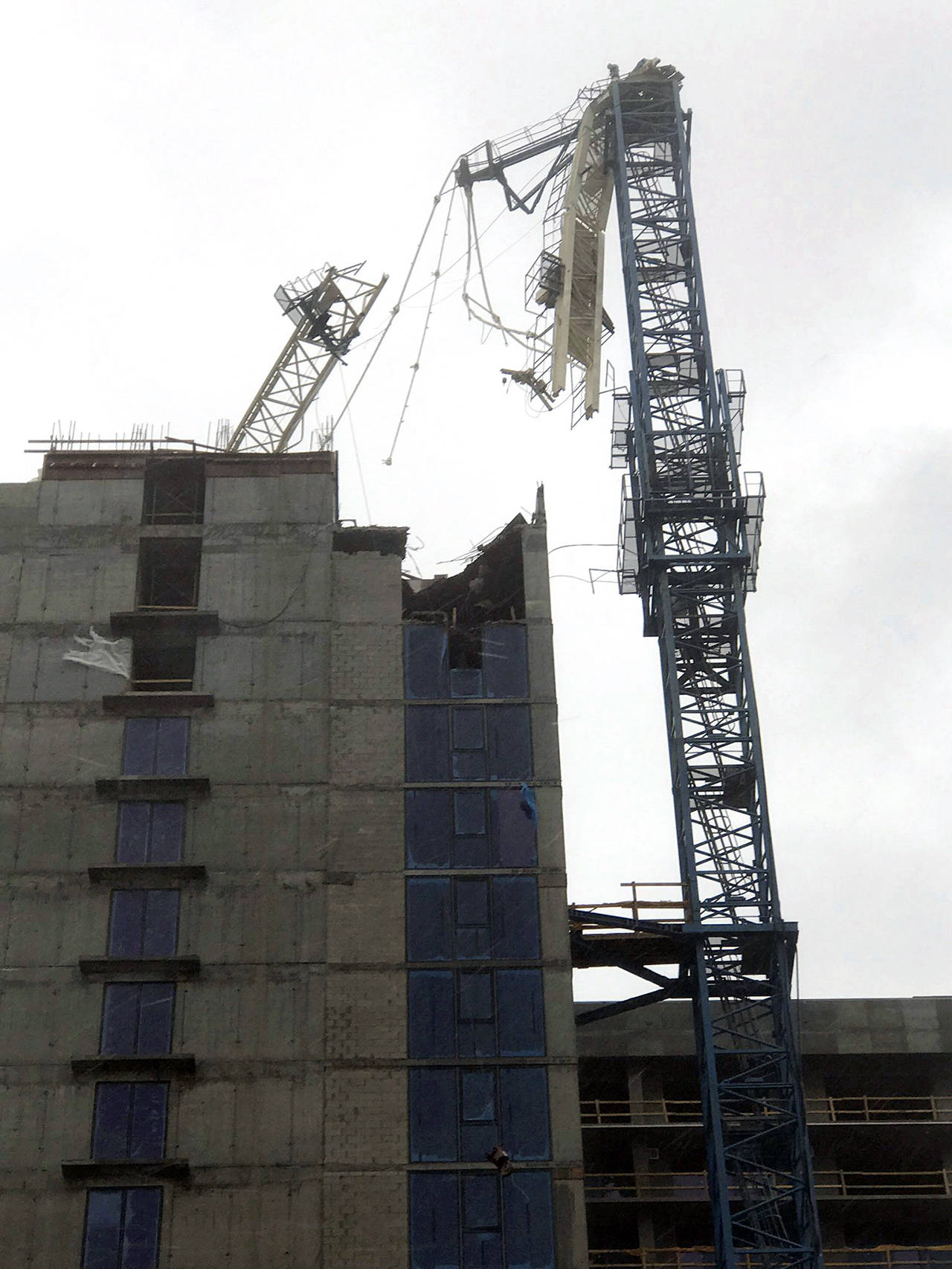 A crane atop a high-rise under construction in downtown Miami collapsed Sunday amid strong winds from Hurricane Irma. (Gideon J. Ape via AP)
