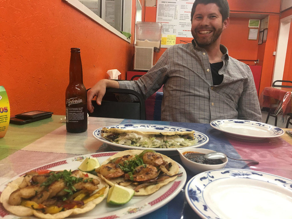 Trevor Lane of Seattle gets ready to settle in for a three-plate feast at Ade’s Mexican Deli in Everett. (Ben Watanabe / The Herald)
