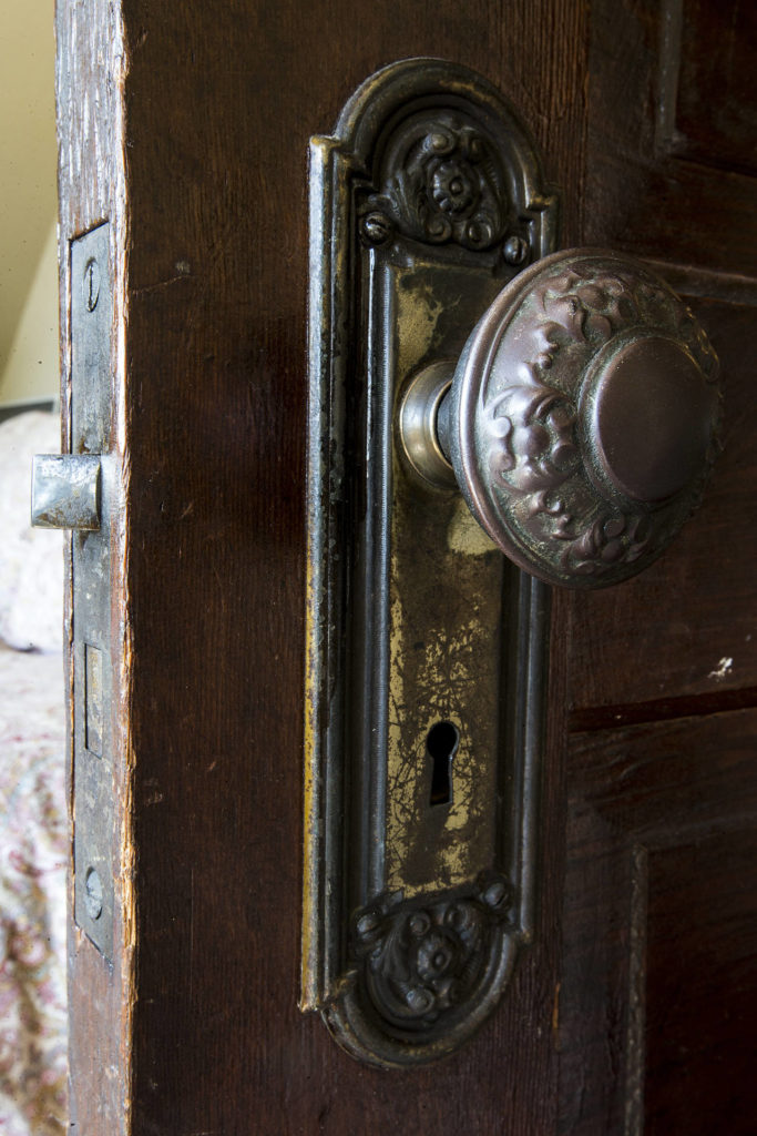Matching original doorknobs can be found on all doors throughout the house. (Ian Terry / The Herald)
