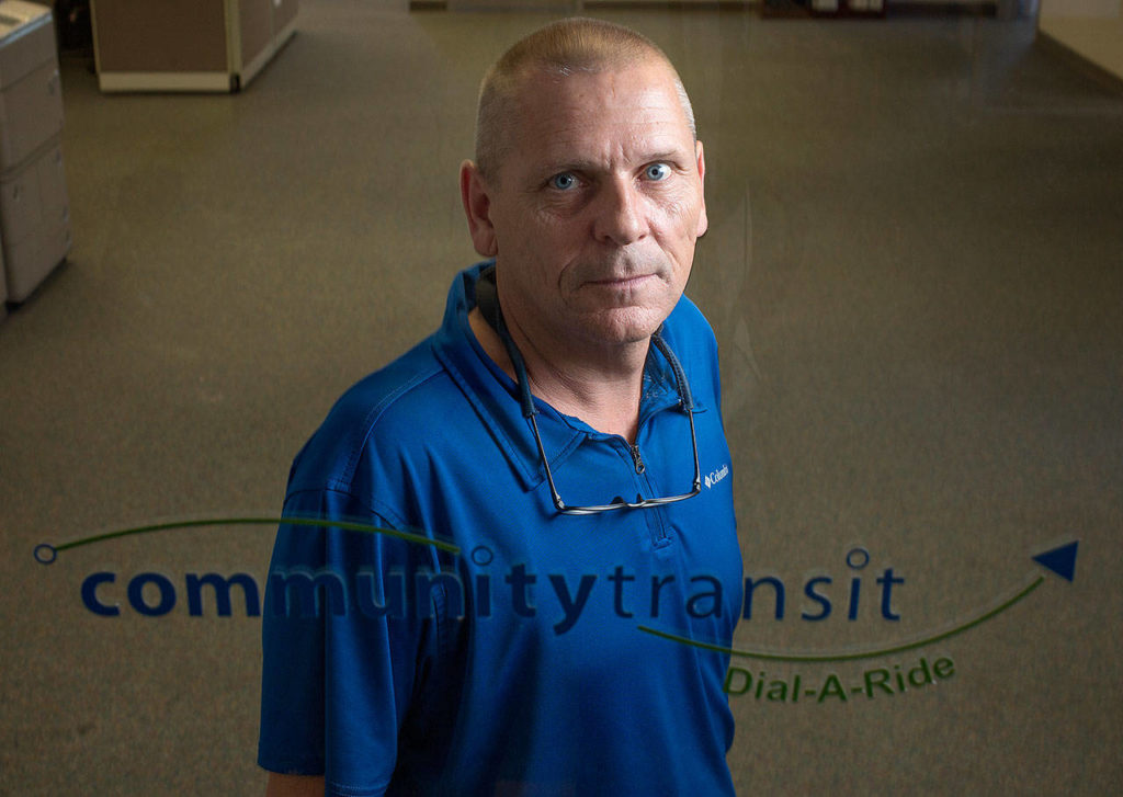 Community Transit Dial-A-Ride Call Center Manager John Hagen at the call center office in Everett. (Andy Bronson / The Herald)
