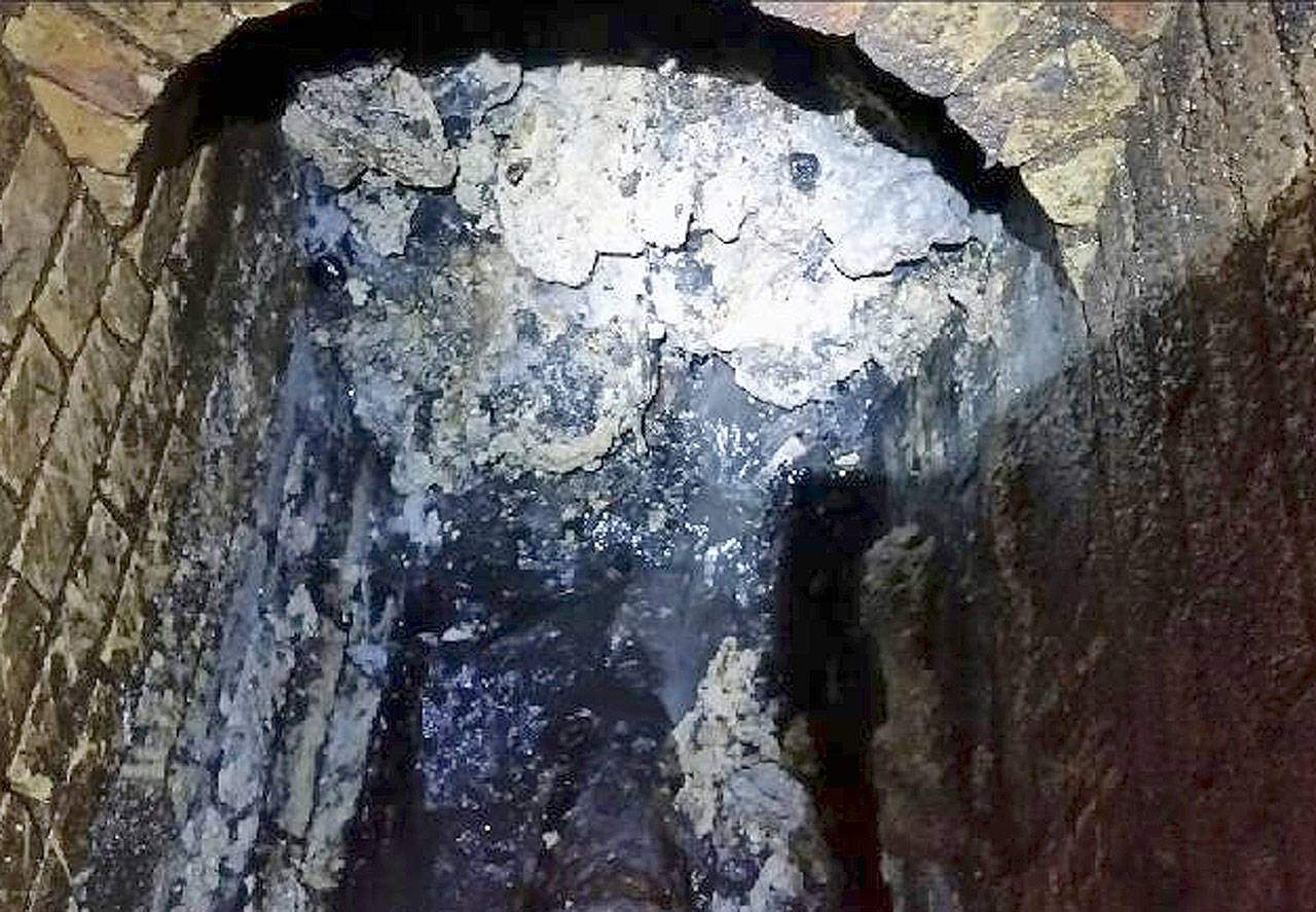 A view of a “fatberg” inside a sewer in Whitechapel, London. British engineers say they have launched a “sewer war” against the giant blob of fat clogging London’s sewers. (Thames Water via AP)