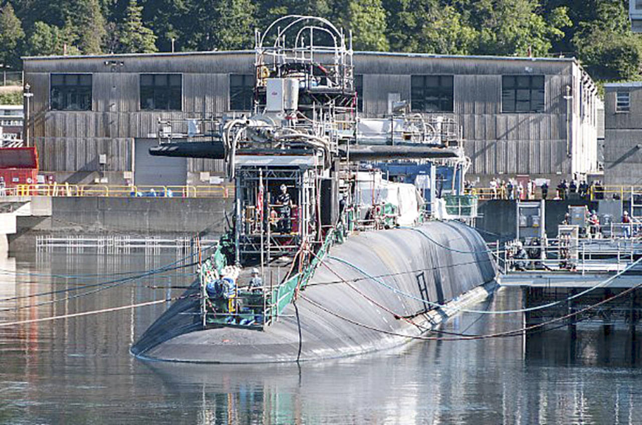 This 2014 photo shows the guided-missile submarine USS Ohio arriving at Puget Sound Naval Shipyard and Intermediate Maintenance Facility for a scheduled major maintenance period. (Jason Kaye / U.S. Navy)