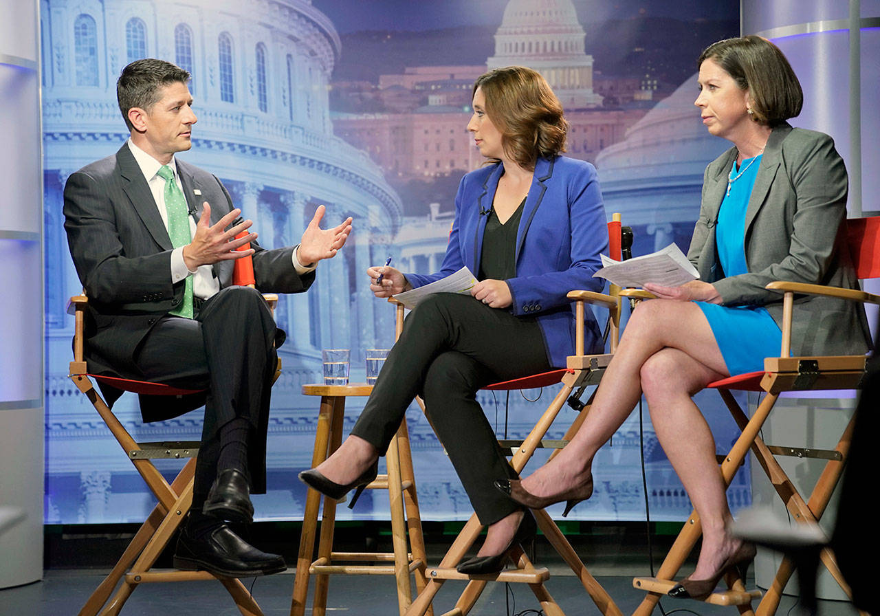 House Speaker Paul Ryan of Wisconsit (left) answers questions during an interview with Julie Pace, AP chief of bureau in Washington and Erica Werner, AP congressional correspondent, at the Associated Press bureau in Washington on Wednesday. (AP Photo/Pablo Martinez Monsivais)