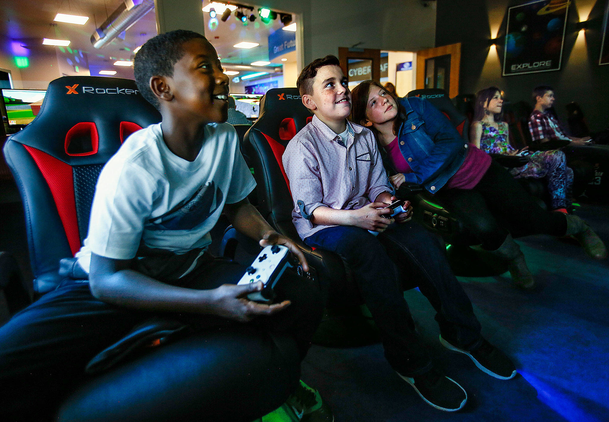 Young students, all from North Lake Middle School, enjoy video games on big screens at the new Dan Pratt Memorial Teen Center in Lake Stevens on Thursday after school let out. From left, they are Shawn Etheridge, 11, Ayden Perez, 11, Riley Gentry, 12, Reegan Pauley, 11, and Brendon Bade, 12. (Dan Bates / The Herald)