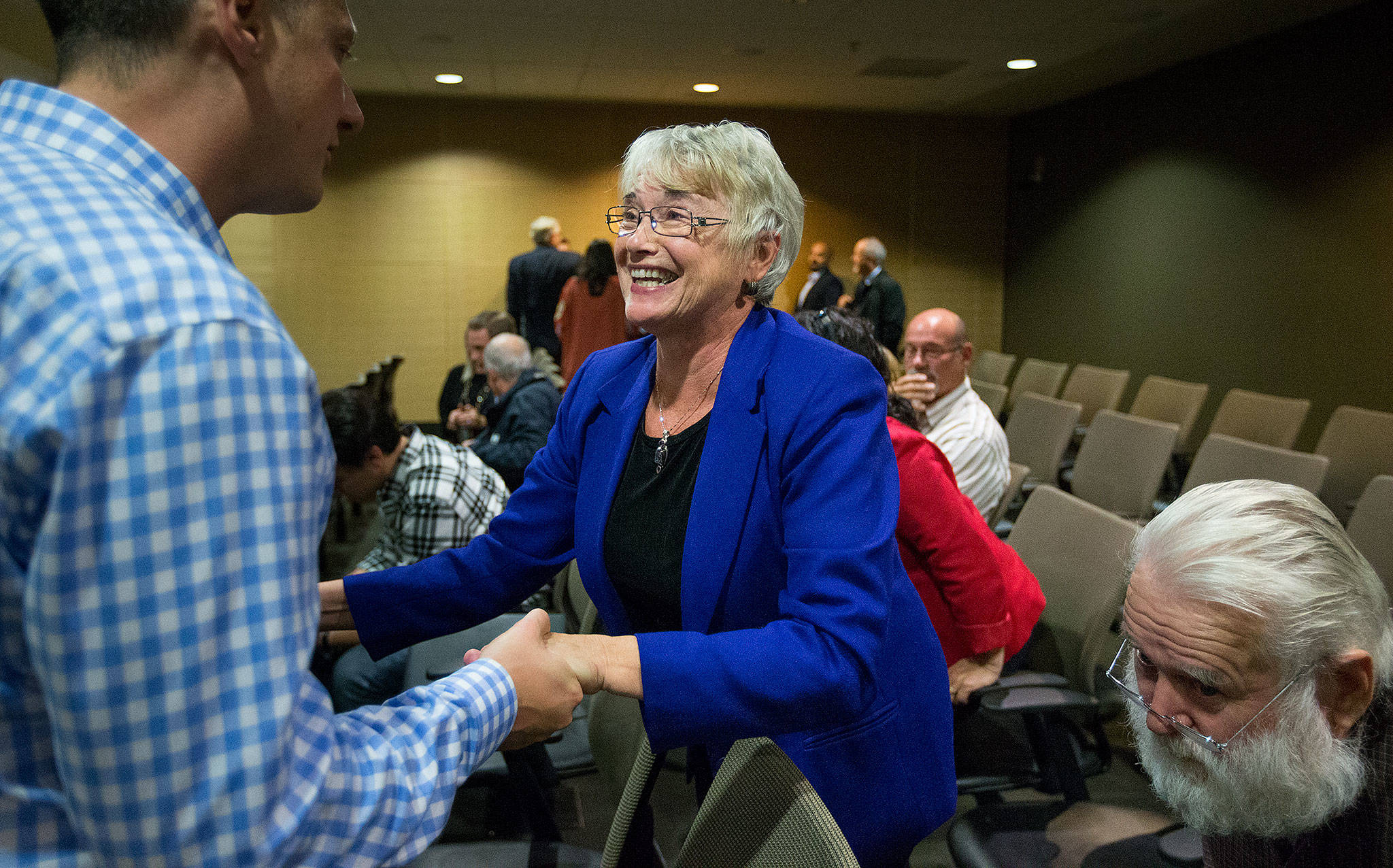 Sultan Mayor Carolyn Eslick is congratulated after she is appointed to fill a vacancy in the state’s House of Representatives at the Snohomish County Council Chambers on Wednesday in Everett. Eslick fills the position created by the resignation of Arlington Republican John Koster. (Andy Bronson / The Herald)
