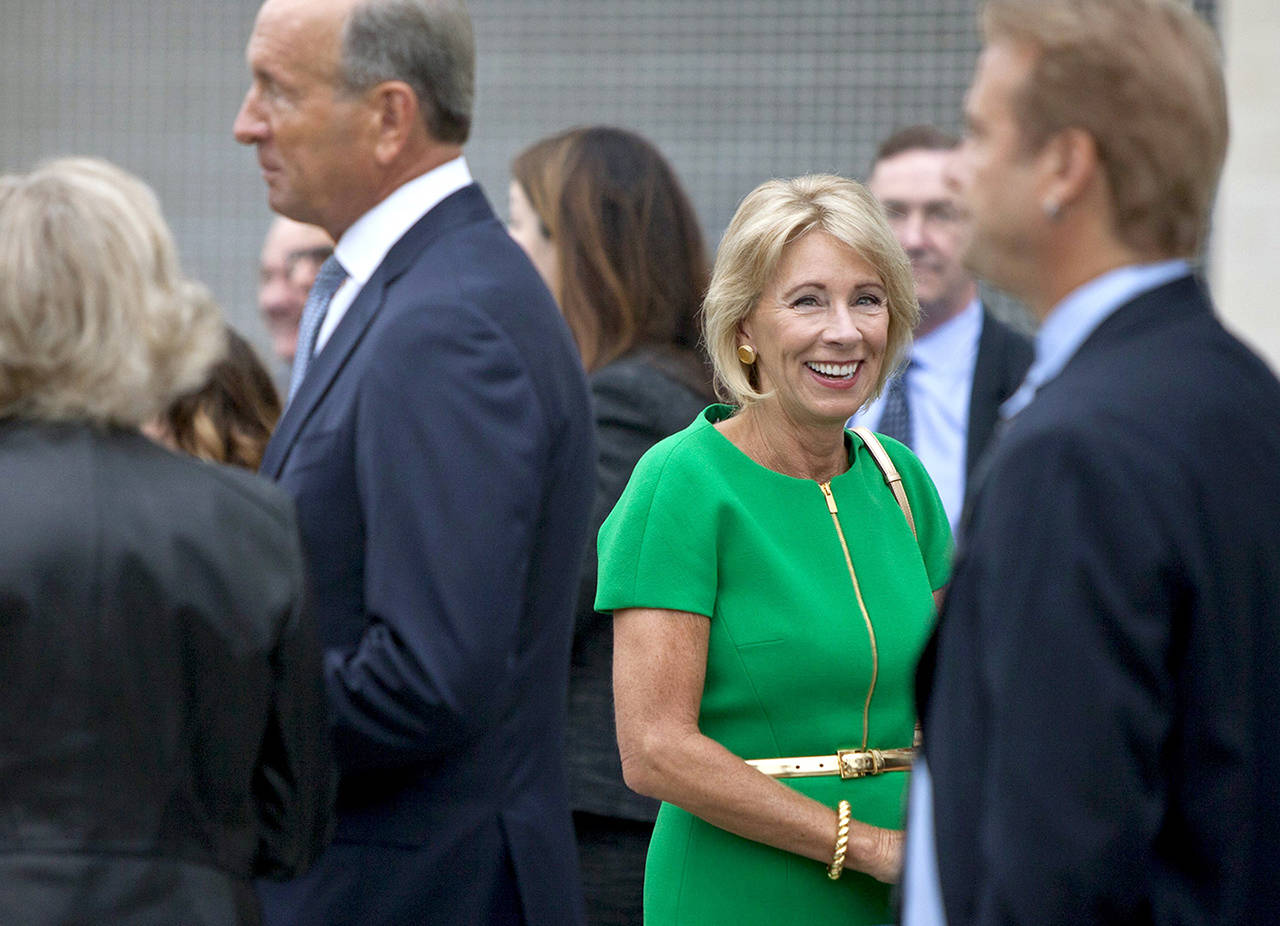 U.S. Education Secretary Betsy DeVos arrives at the dedication ceremony of Michigan State University’s new Grand Rapids Medical Research Center on Wednesday in Grand Rapids, Michigan. (Cory Morse /The Grand Rapids Press via AP)