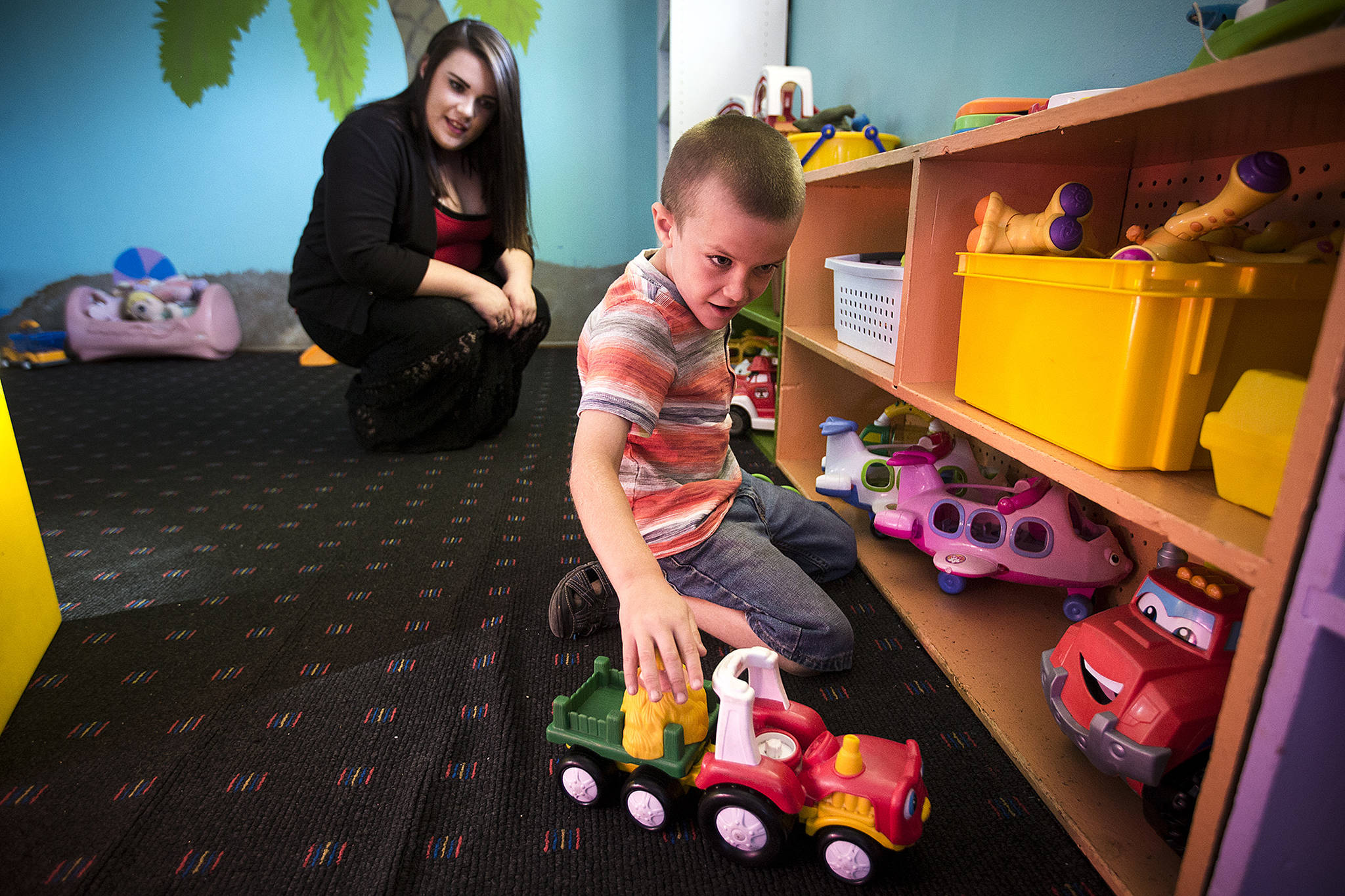 Joshua Latimer, 7, plays at Another Best Child Care in Everett while his mother, Leigh Anne, watches Friday. Latimer, who is on the autism spectrum, hasn’t been able to attend school yet this year because of a transportation issue with the Mukilteo School District. (Ian Terry / The Herald)