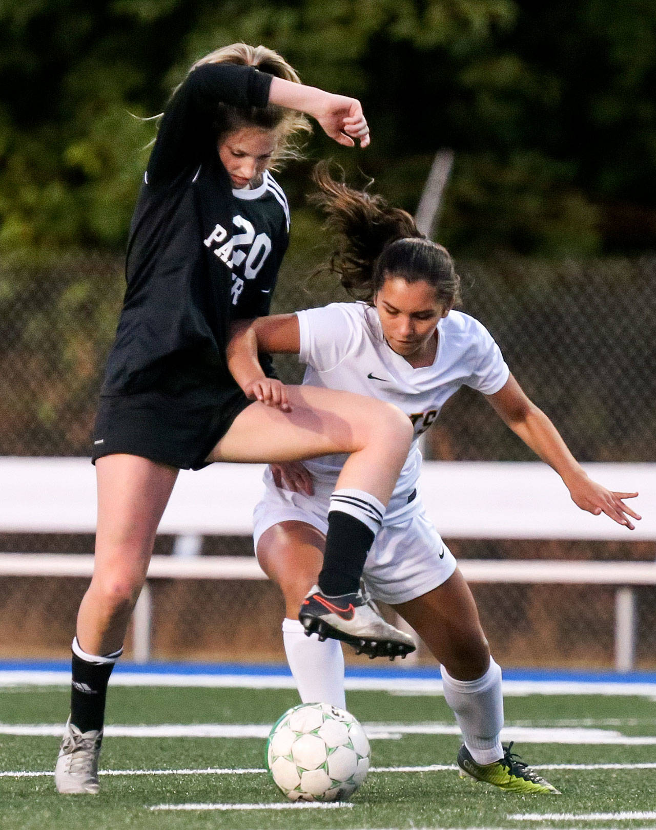 Snohomish’s Jenna Schuler (left) battles Shorecrest’s Jacy Elizondo for possession during a Wesco 3A match Thursday night at Shoreline Stadium. Schuler and the Panthers beat Elizondo’s Scots 1-0. (Kevin Clark / The Herald)