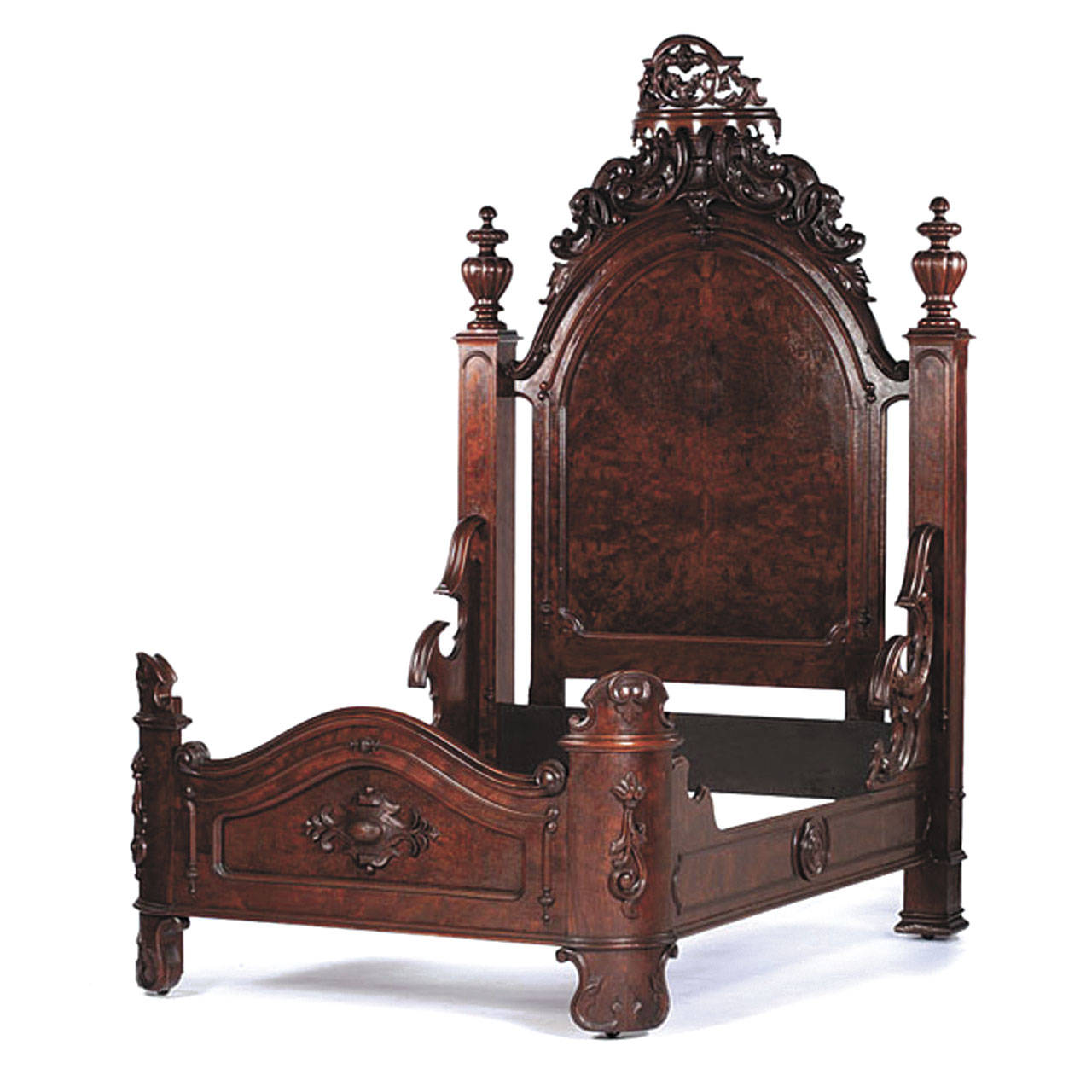 A set of furniture that would fill the bedroom sold for $5,400 at an auction in the Midwest. It was made from solid walnut with burl and carved trim. (Cowles Syndicate Inc.)