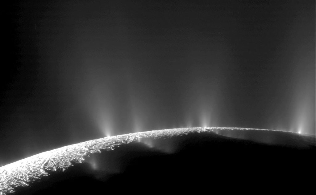 Plumes of water ice and vapor from the south polar region of Saturn’s moon, Enceladus, in 2005. The activity is understood to originate from the moon’s subsurface ocean of salty liquid water, which is venting into space. (NASA/JPL/Space Science Institute via AP)
