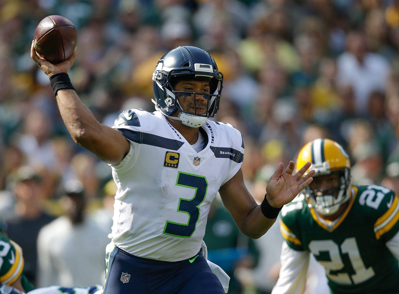 Seahawks quarterback Russell Wilson throws during the first half of a game against the Packers on Sept. 10, 2017, in Green Bay, Wis. (AP Photo/Jeffrey Phelps)