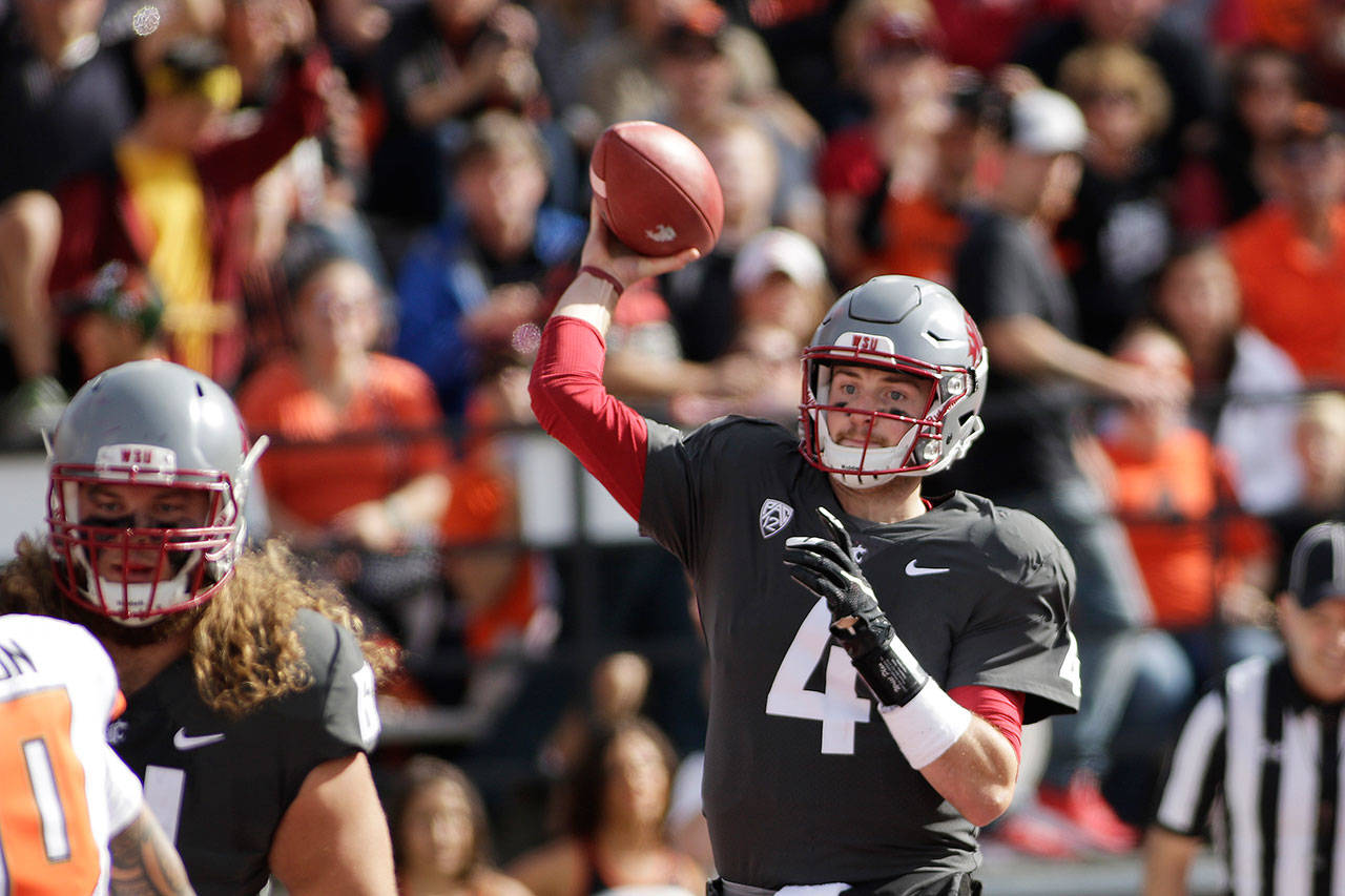Washington State quarterback Luke Falk (4) throws a pass during the first half of a game against Oregon State on Sept. 16, 2017, in Pullman. (AP Photo/Young Kwak)