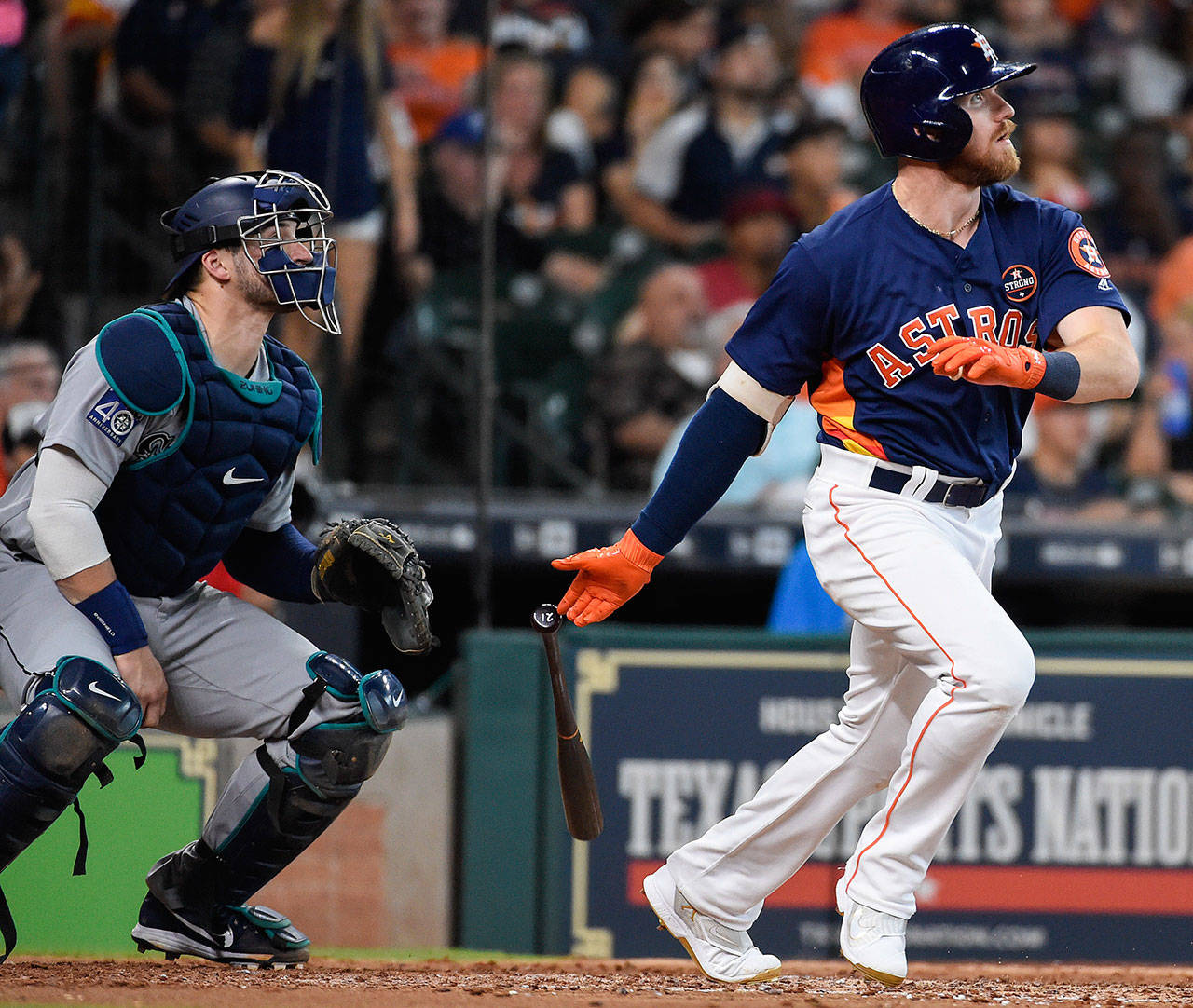 Houston Astros’ Derek Fisher watches his two-run home run off Seattle starting pitcher Andrew Moore during the fifth inning of Sunday’s game in Houston. (AP Photo/Eric Christian Smith)