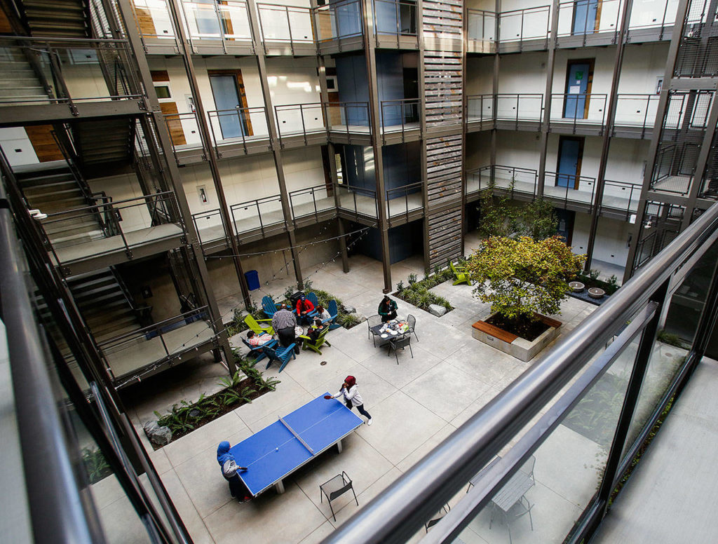 The new Cedar Hall, a residence hall at EvCC, has four-bedroom and three-bedroom suites and studio apartments all opening onto a secure open-air courtyard. Ammenities include a gas fire pit, ping pong table, TV lounge and laundry facilities. Up to 132 people can have their own bedrooms. (Dan Bates / The Herald)
