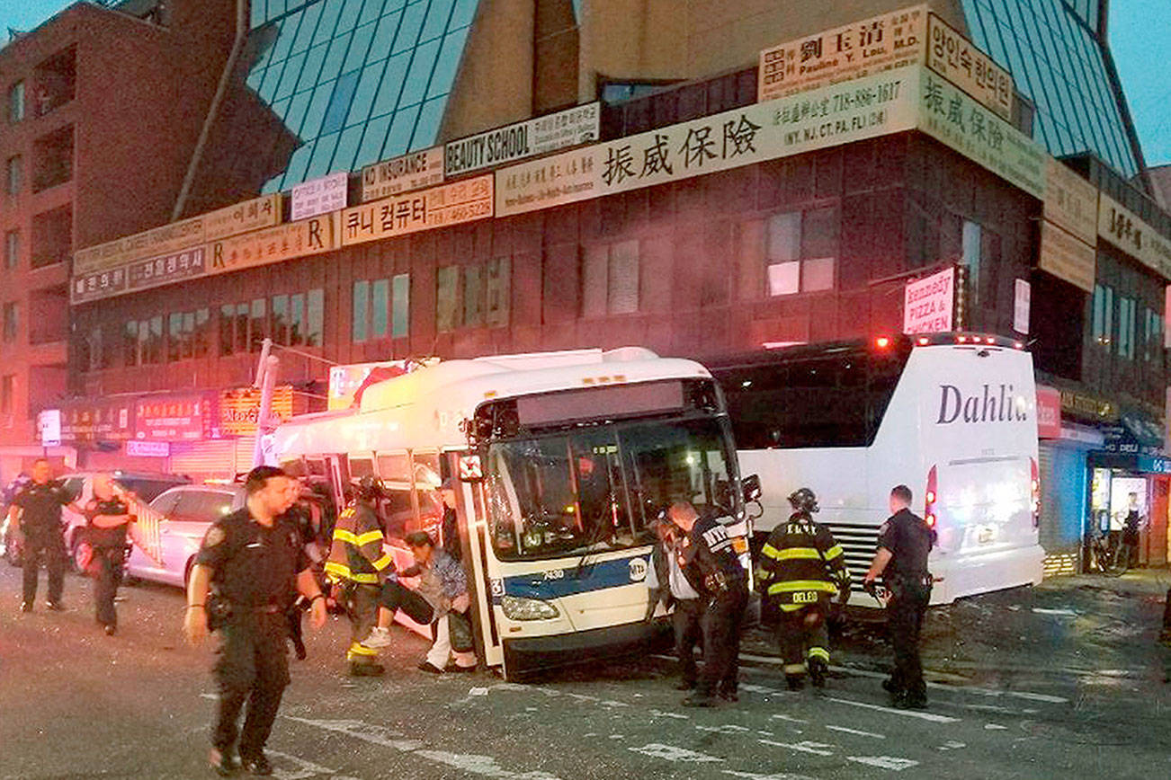 Charter bus barrels into NYC bus, killing 3 and injuring 16